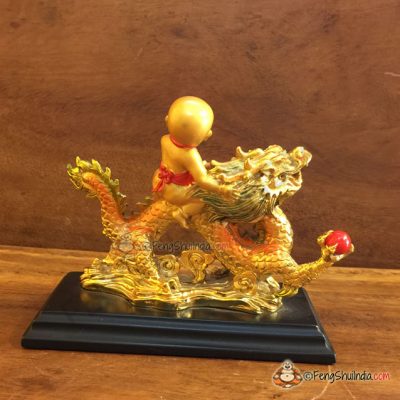 Qui Yong riding Dragon